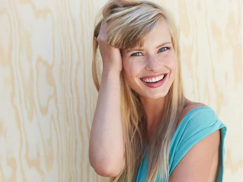 how to get rid of orange hair at home featured image woman with cool blonde hair