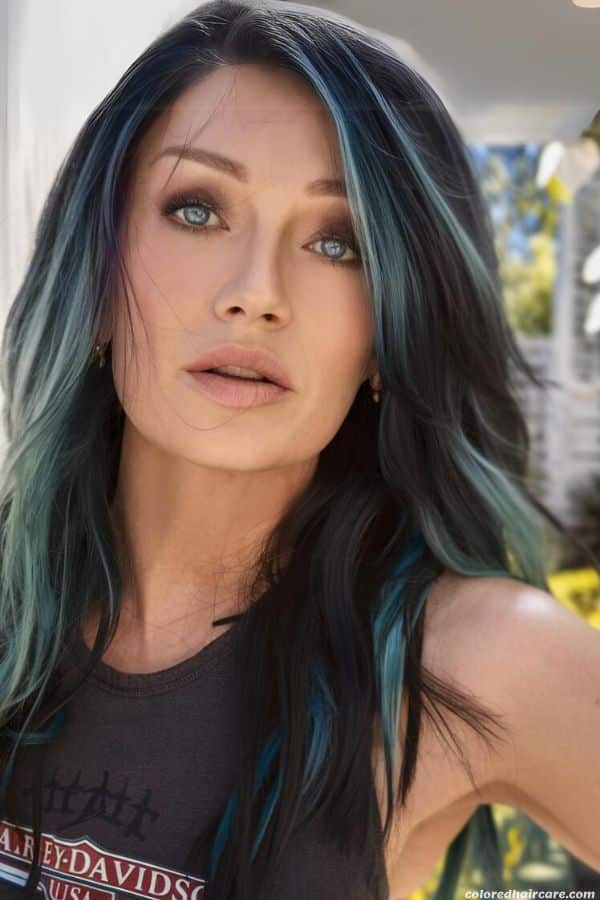 The Best Hair Colors To Make Blue Eyes Really Pop 9 woman with midnight blue hair and blue eyes