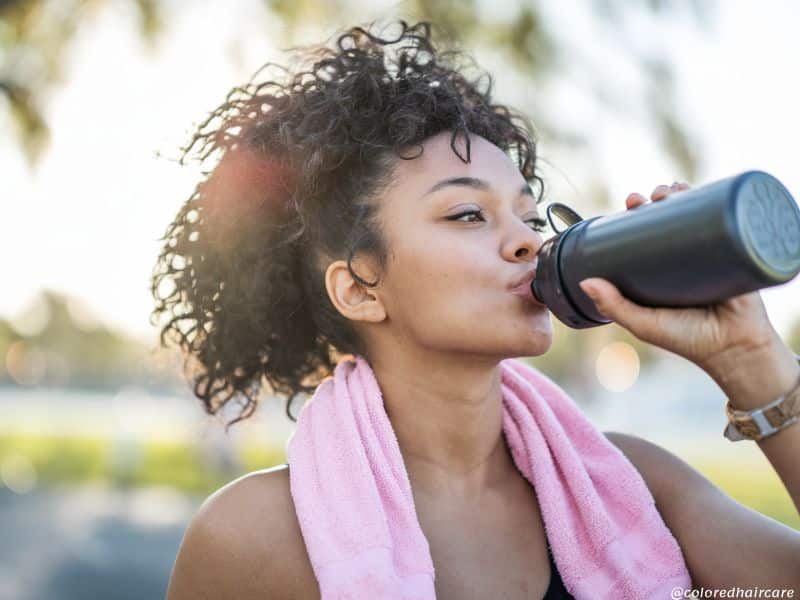 How to Keep Your Hair Happy This Winter – 7 Expert Tips for Every Hair Type 6 healthy hair tips woman exercising and drinking water