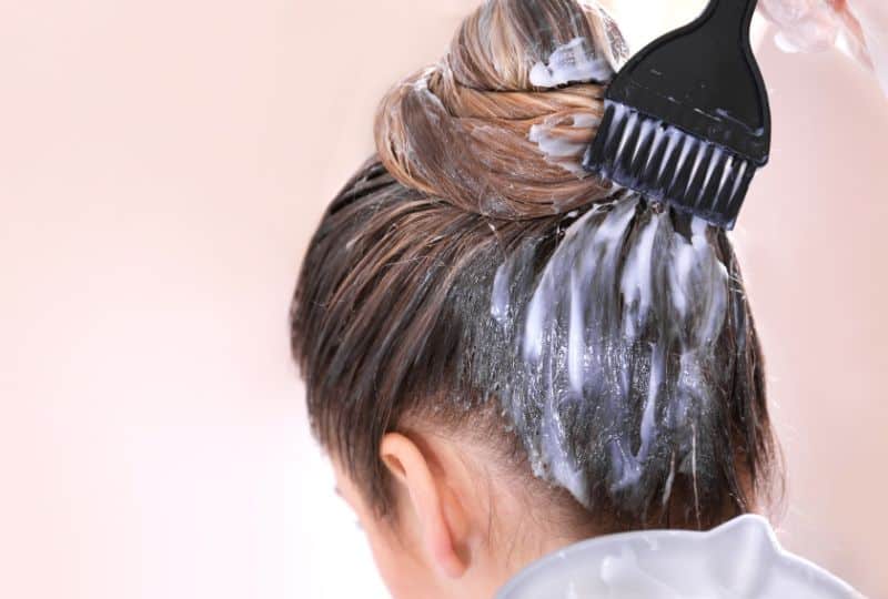 Top 9 Hair Dye Mistakes People Make and How to Avoid Them 8 hair dye mistakes and how to avoid them - a lady applying hair dye at home to dirty hair