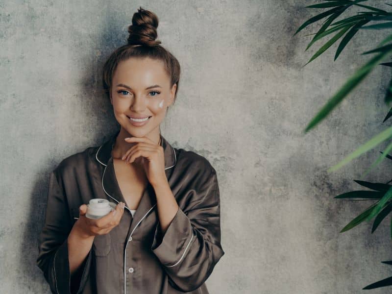 Weekly Hair Care Routine - woman relaxing with hair tied in messy knot