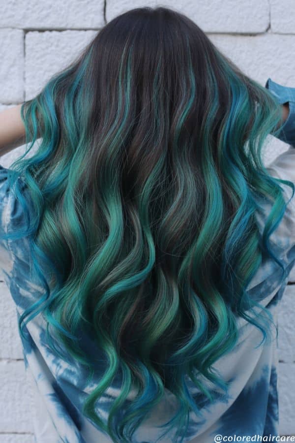 25 Balayage Ideas for Black Hair That Actually Pop (2025 Looks & Tips) 24 Jewel-toned jade green highlights on black hair for edgy look
