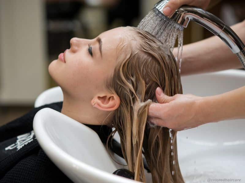 woman having her hair shampooed in a hair salon